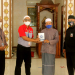 Ramli AB (kiri) mewakili JNE dalam acara Penyerahan donasi 100 mushaf Al-Quran dari JNE kepada H. Ibrahim selaku Ketua DKM Masjid Al-Muttaqien, Perum Talaga Bestari, Tangerang