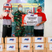 Vice President of Marketing JNE, Eri Palgunadi, menyerahkan donasi kepada Mayor Hadi Wahono selaku koordinator logistik RSDC Wisma Atlet