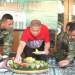 presdir jne memotong tumpeng di HUT 56 Brigif Kostrad