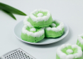 Putu Ayu traditional Indonesian cake. The cake is green with the aroma of pandan and grated coconut topping.