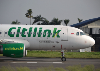 bandung, indonesia-june 16, 2014: Citilink airplane taking manoeuvre on husein sastranegara airport bandung.