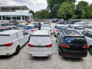 bekasi, indonesia : 26 november 2021 - Wuling Cortez car in the car park. automotive manufacturing company factory background concept, transport, transportation, car repair shop, show room